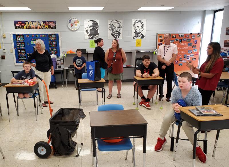 The litter cart holds a trash bag